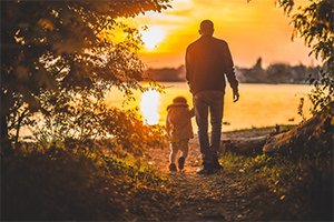 Dad walking with kid